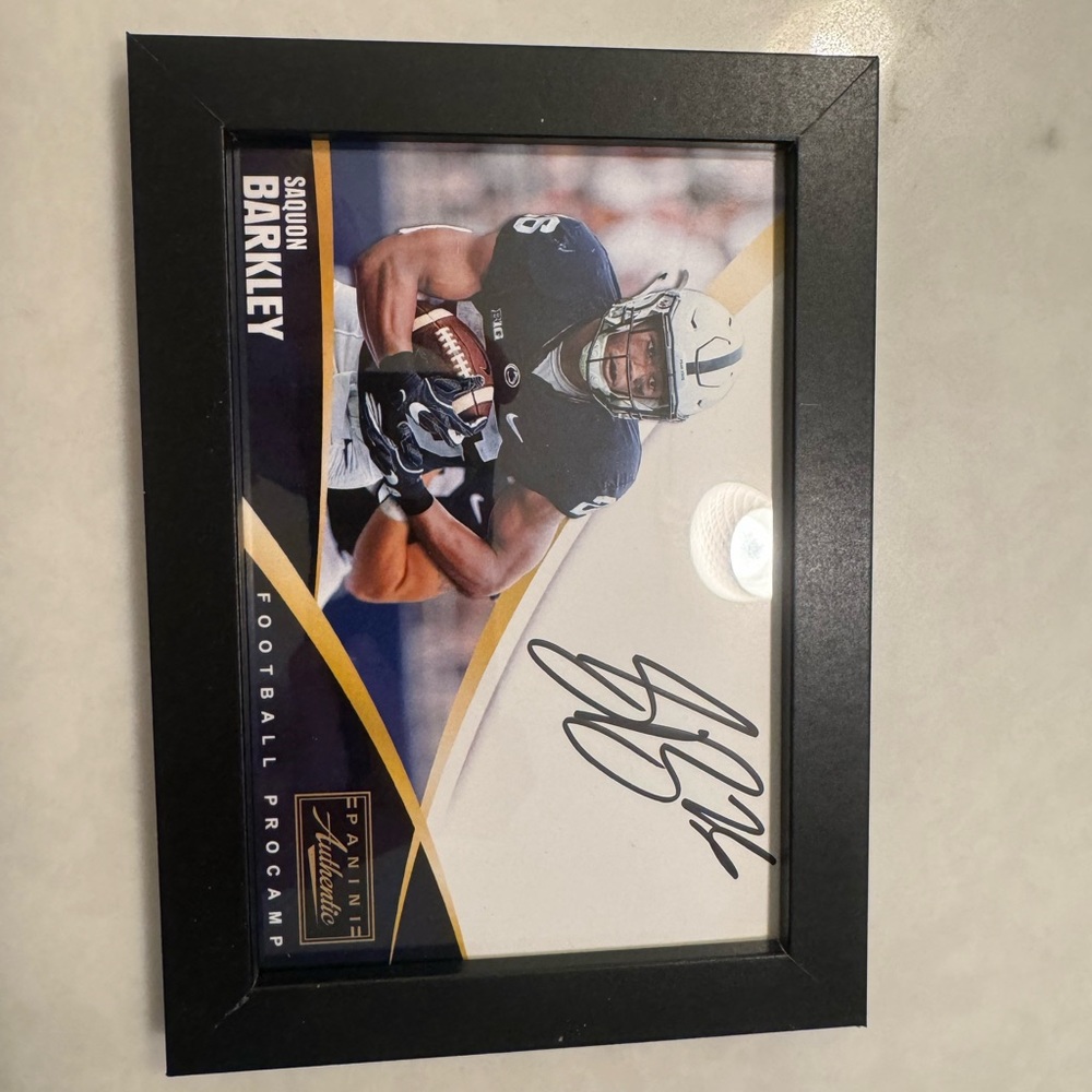 authentic saquaon Barkley signed picture.